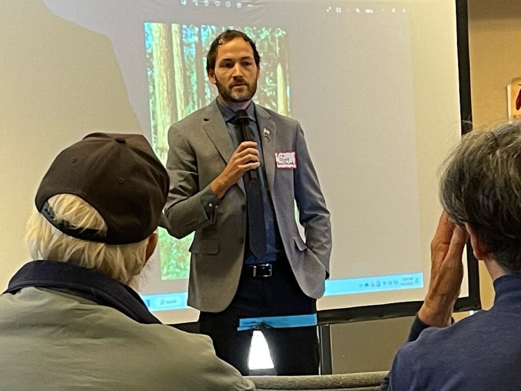 Bernalillo County Commissioner Eric Olivas speaks with residents in 2023