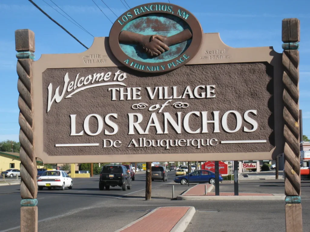 A sign welcomes people to the village of Los Ranchos.